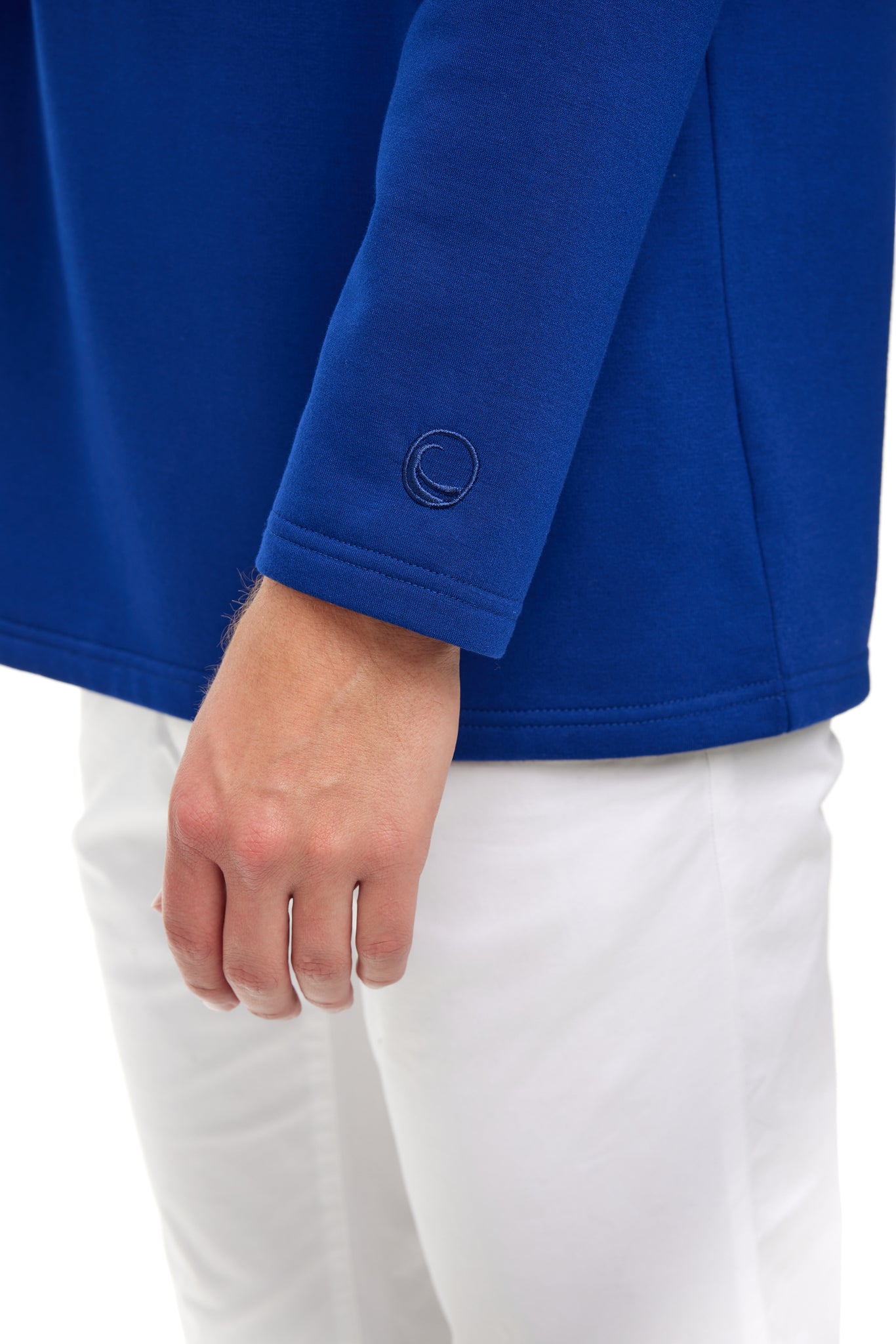 male model wearing blue pullover, cuff and hand shown,  best pullover to wear to the beach, coastal clothing, vacation clothes, florida sweater